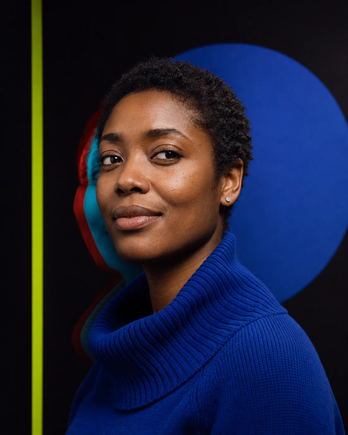 Portrait lit in ultramarine with coral and lime accents
